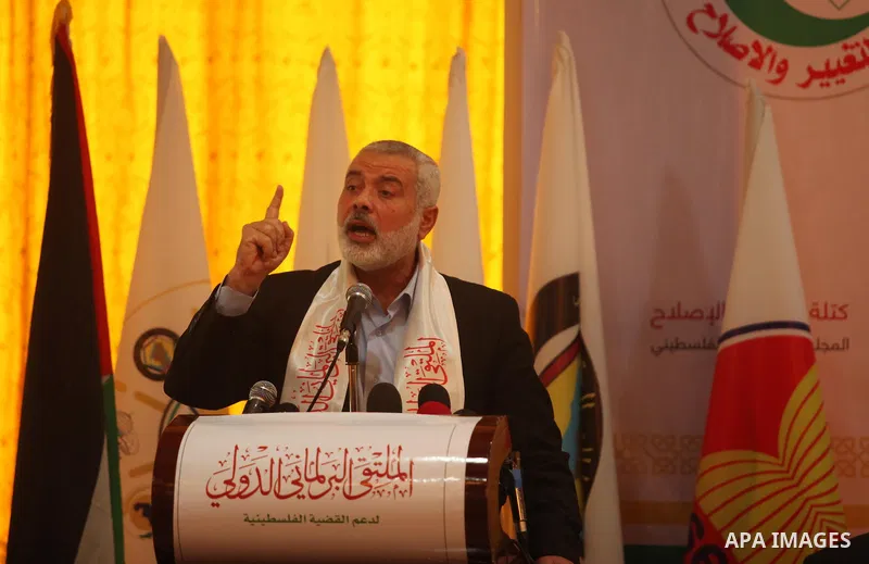 Senior Hamas leader Ismail Haniya speaks during a meeting of the International Forum of Parliament, in Gaza city, on April 10, 2016. Photo by Ashraf Amra