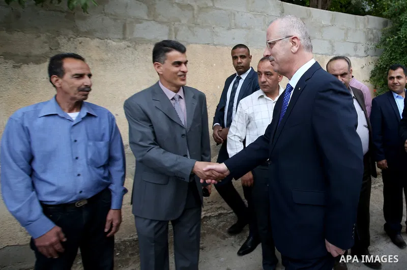 Palestinian Prime Minister, Rami hamdallah, takes part the closing ceremony, "a project to promote peace-building through Japanese sewage management in the West Bank city of Ramallah on April 11, 2016. Photo by Prime Min...