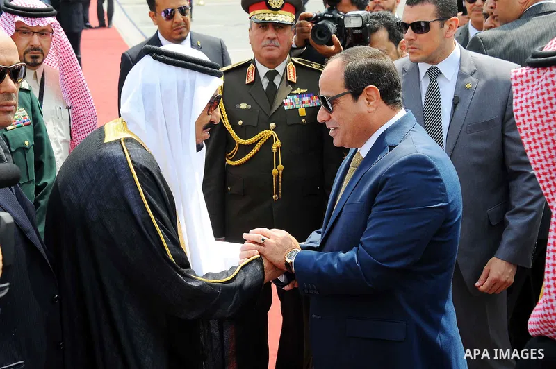 Saudi King Salman shake hands with Egyptian President Abdel Fattah al-Sisi before leaving Cairo's international airport on April 11, 2016. Photo by Egyptian President Office