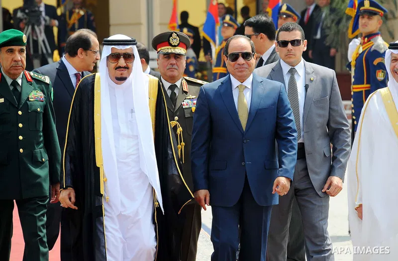Saudi King Salman walks alongside Egyptian President Abdel Fattah al-Sisi before leaving Cairo's international airport on April 11, 2016. Photo by Egyptian President Office