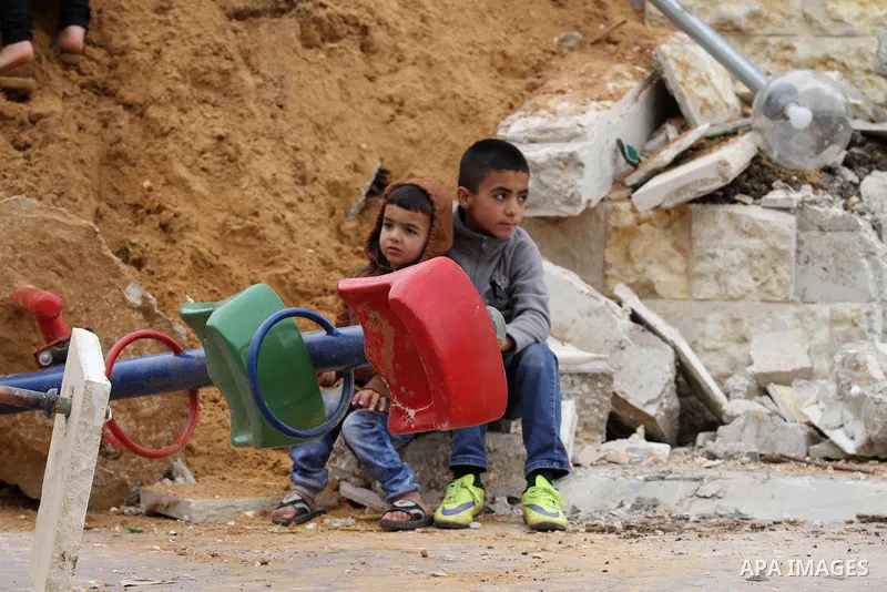 Palestinian children inspect the damage to a children's garden after it was demolished by Israeli troops in the village of Za'tara near the West Bank city of Nablus, Tuesday, April 12, 2016. Israeli forces demolished the...