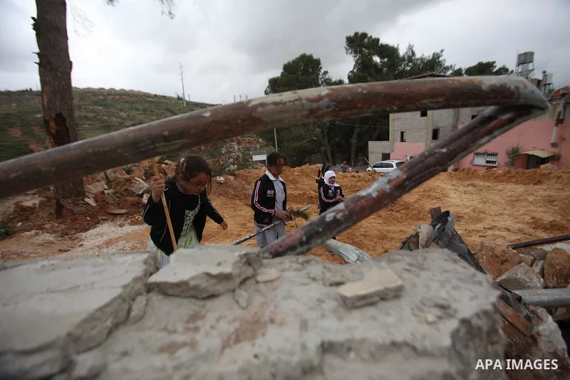 Palestinian children inspect the damage to a children's garden after it was demolished by Israeli troops in the village of Za'tara near the West Bank city of Nablus, Tuesday, April 12, 2016. Israeli forces demolished the...