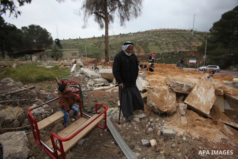 A Palestinian man inspects the damage to a children's garden after it was demolished by Israeli troops in the village of Za'tara near the West Bank city of Nablus, Tuesday, April 12, 2016. Israeli forces demolished the c...