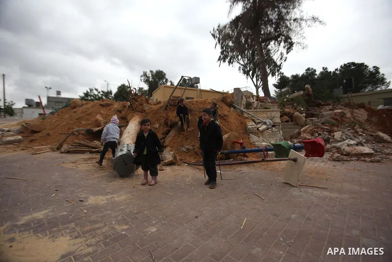 Palestinian children inspect the damage to a children's garden after it was demolished by Israeli troops in the village of Za'tara near the West Bank city of Nablus, Tuesday, April 12, 2016. Israeli forces demolished the...
