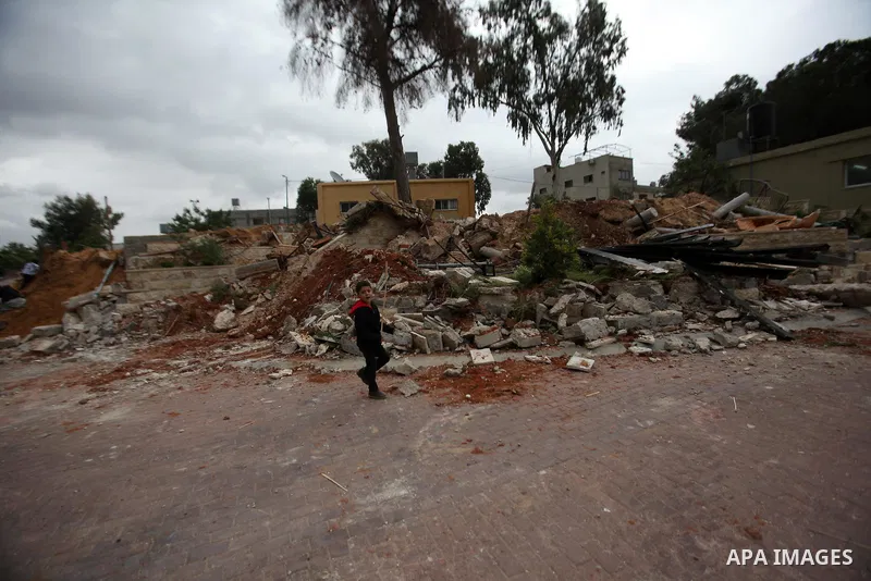 Palestinian children inspect the damage to a children's garden after it was demolished by Israeli troops in the village of Za'tara near the West Bank city of Nablus, Tuesday, April 12, 2016. Israeli forces demolished the...