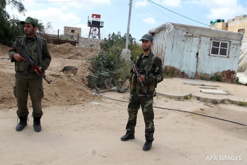 Members of Palestinian security forces stand guard in front of the Gaza-Egypt border in Rafah in the southern Gaza Strip, on April 14, 2016. Senior Hamas leader Ismail Haniyeh confirmed that Hamas spares no measures to p...