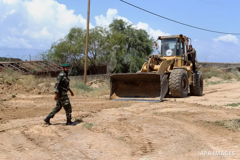 Palestinian bulldozer works in front of the Gaza-Egypt border in Rafah in the southern Gaza Strip, on April 14, 2016. Senior Hamas leader Ismail Haniyeh confirmed that Hamas spares no measures to protect the Gaza-Egypt b...