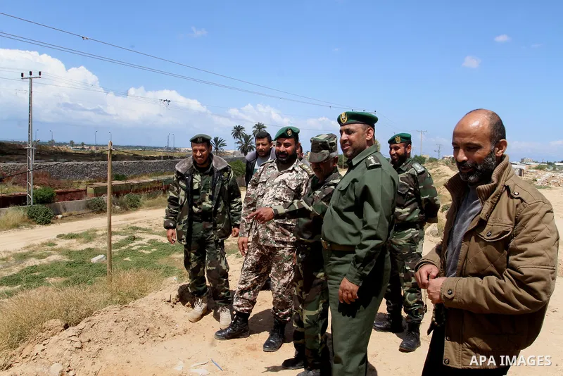 Members of Palestinian security forces stand guard in front of the Gaza-Egypt border in Rafah in the southern Gaza Strip, on April 14, 2016. Senior Hamas leader Ismail Haniyeh confirmed that Hamas spares no measures to p...