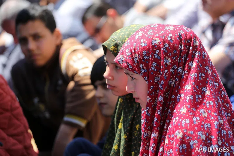 Palestinians attend Friday prayers in front of Red cross office in Gaza city on April 15, 2016. Photo by Mohammed Asad