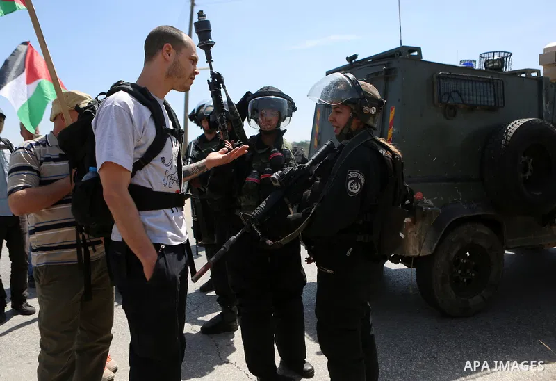 Palestinian protesters scuffle with an Israeli security forces during clashes following a march against Palestinian land confiscation on April 15, 2016 in the West Bank village of Nabi Saleh near Ramallah. Photo by Shadi...