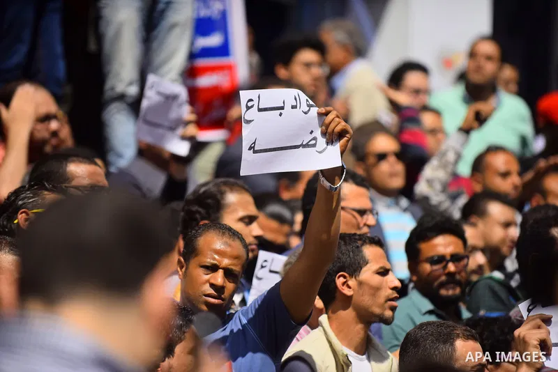 Egyptian activists shout slogans against President Abdel Fattah al-Sisi and his government, during a demonstration protesting the government's decision to transfer two Red Sea islands to Saudi Arabia, in front of the Pre...