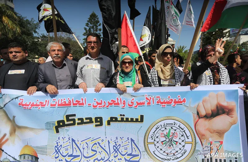 Palestinians take part during a rally marking Palestinian Prisoner Day in Gaza City on April 17, 2016. Photo by Mohammed Asad