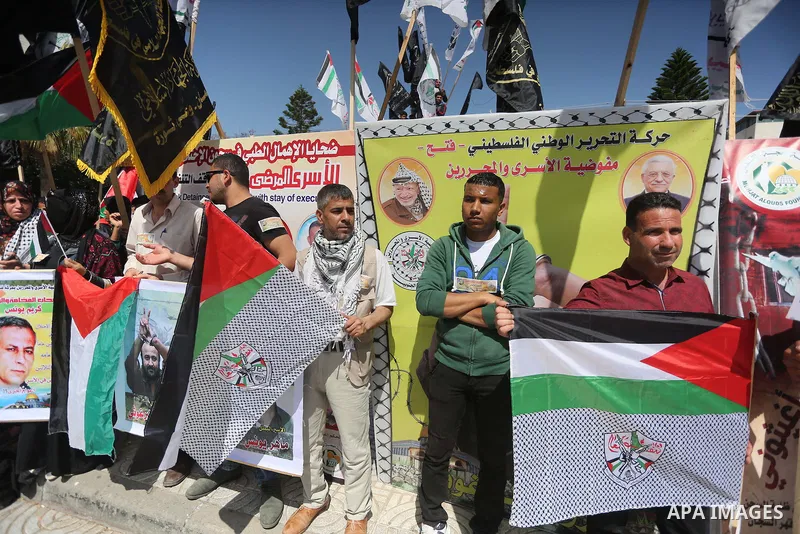 Palestinians take part during a rally marking Palestinian Prisoner Day in Gaza City on April 17, 2016. Photo by Mohammed Asad