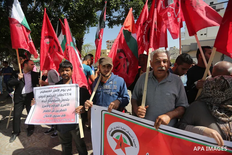 Palestinians take part during a rally marking Palestinian Prisoner Day in Gaza City on April 17, 2016. Photo by Mohammed Asad