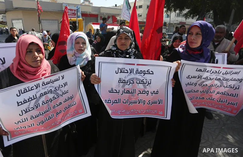Palestinians take part during a rally marking Palestinian Prisoner Day in Gaza City on April 17, 2016. Photo by Mohammed Asad