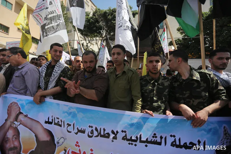 Palestinians take part during a rally marking Palestinian Prisoner Day in Gaza City on April 17, 2016. Photo by Mohammed Asad