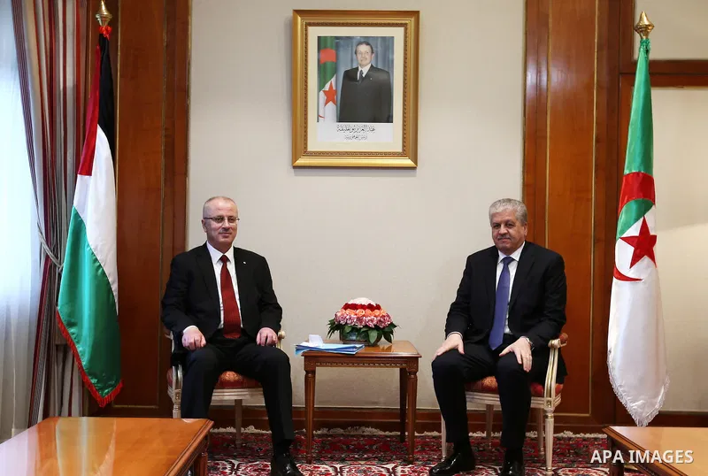 Palestinian Prime Minister Rami Hamdallah meets with Algerian Prime Minister Abdelmalek Sellal during his visit to Algeria, on April 18, 2016. Photo by Prime Minister Office