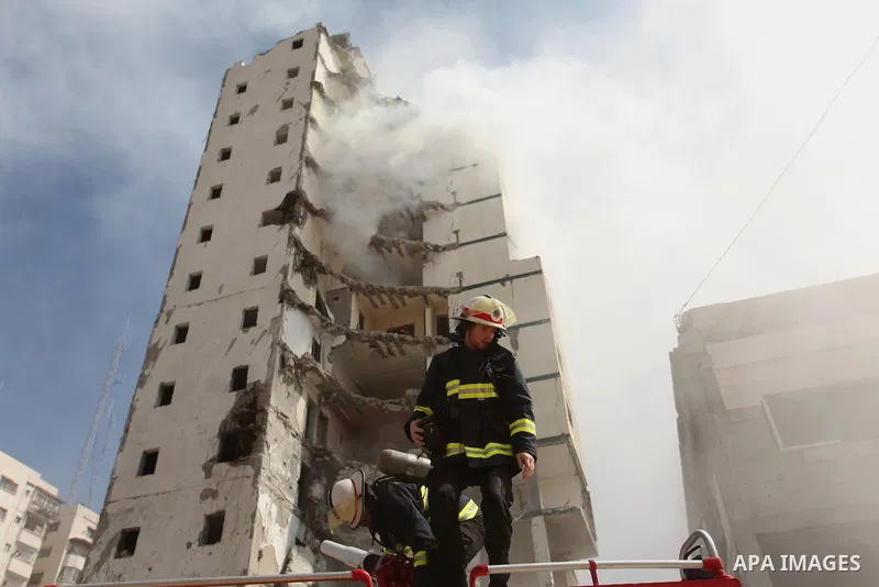 Palestinian emergency personnel take part in a drill in a building which was destroyed during the 50-day war between Israel and Hamas militants in the summer of 2014, in Gaza City, on April 19, 2016. Photo by Ashraf Amra