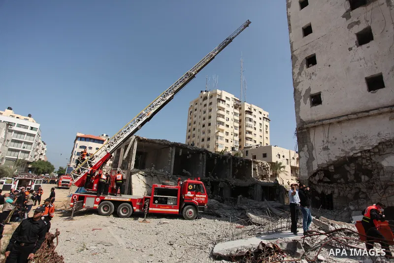 Palestinian emergency personnel take part in a drill in a building which was destroyed during the 50-day war between Israel and Hamas militants in the summer of 2014, in Gaza City, on April 19, 2016. Photo by Ashraf Amra