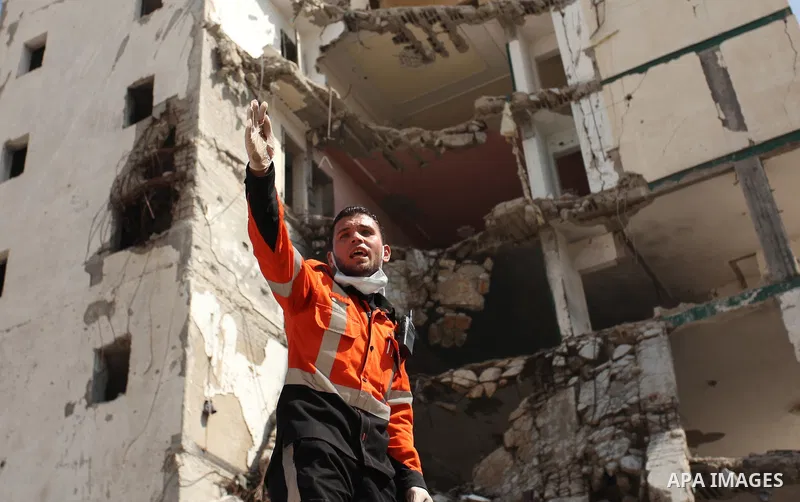 Palestinian emergency personnel take part in a drill in a building which was destroyed during the 50-day war between Israel and Hamas militants in the summer of 2014, in Gaza City, on April 19, 2016. Photo by Ashraf Amra