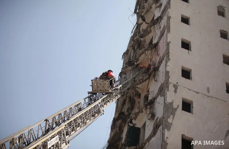Palestinian emergency personnel take part in a drill in a building which was destroyed during the 50-day war between Israel and Hamas militants in the summer of 2014, in Gaza City, on April 19, 2016. Photo by Ashraf Amra