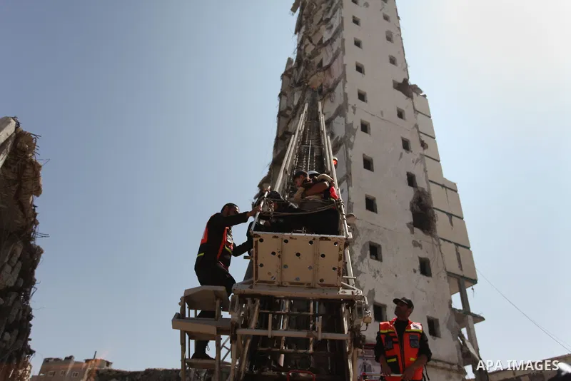 Palestinian emergency personnel take part in a drill in a building which was destroyed during the 50-day war between Israel and Hamas militants in the summer of 2014, in Gaza City, on April 19, 2016. Photo by Ashraf Amra