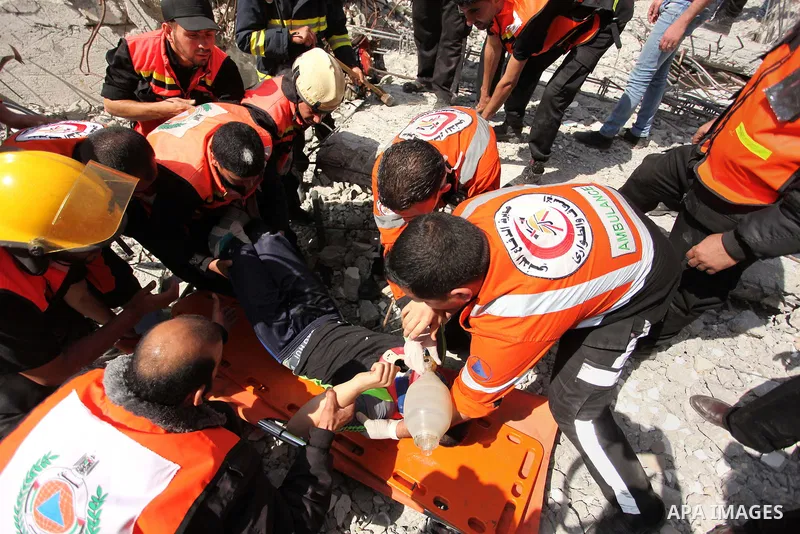Palestinian emergency personnel take part in a drill in a building which was destroyed during the 50-day war between Israel and Hamas militants in the summer of 2014, in Gaza City, on April 19, 2016. Photo by Ashraf Amra