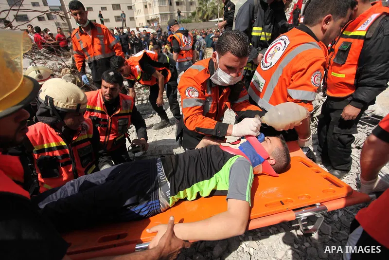 Palestinian emergency personnel take part in a drill in a building which was destroyed during the 50-day war between Israel and Hamas militants in the summer of 2014, in Gaza City, on April 19, 2016. Photo by Ashraf Amra