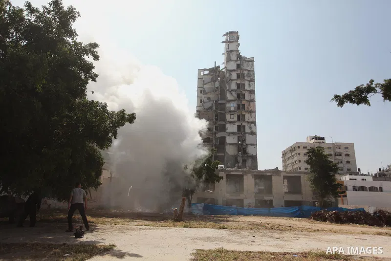 Palestinian emergency personnel take part in a drill in a building which was destroyed during the 50-day war between Israel and Hamas militants in the summer of 2014, in Gaza City, on April 19, 2016. Photo by Ashraf Amra