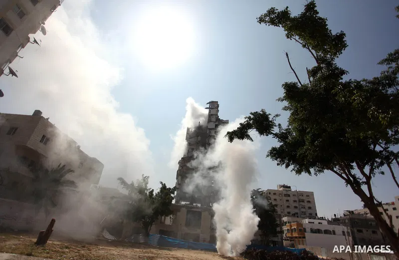 Palestinian emergency personnel take part in a drill in a building which was destroyed during the 50-day war between Israel and Hamas militants in the summer of 2014, in Gaza City, on April 19, 2016. Photo by Ashraf Amra