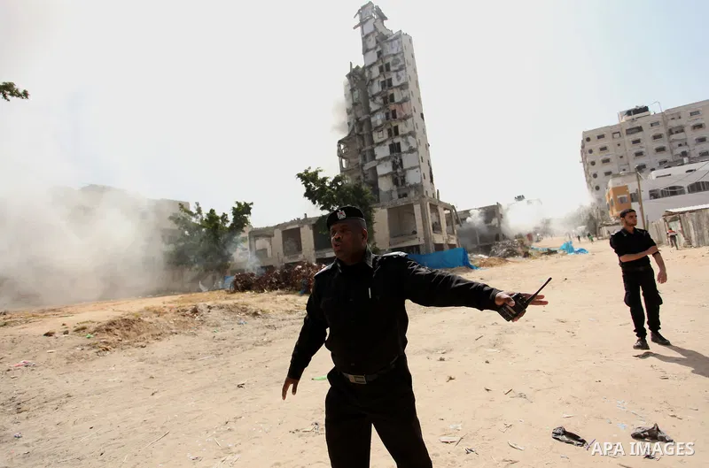 Palestinian emergency personnel take part in a drill in a building which was destroyed during the 50-day war between Israel and Hamas militants in the summer of 2014, in Gaza City, on April 19, 2016. Photo by Ashraf Amra