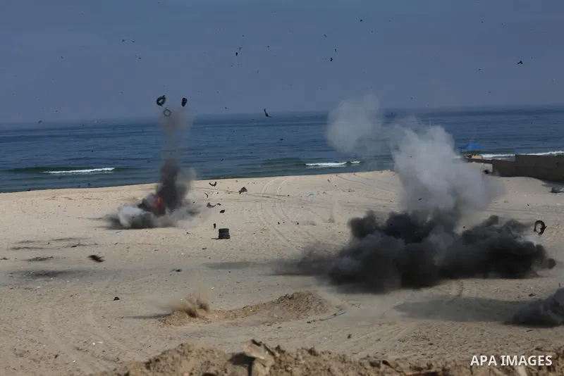 Palestinian emergency personnel take part in a drill ,at the beach of the Mediterranean sea on the coast of Gaza city, on April 19, 2016. Photo by Mohammed Asad