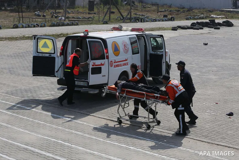 Palestinian emergency personnel take part in a drill , in Gaza City, on April 19, 2016. Photo by Mohammed Asad
