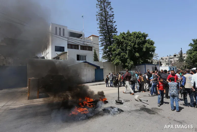Palestinian owners of houses which were destroyed during the recent Israeli war, take part in a protest, in front of high commissioner for human rights headquarters, in Gaza City on April 20, 2016. Israeli occupation pri...
