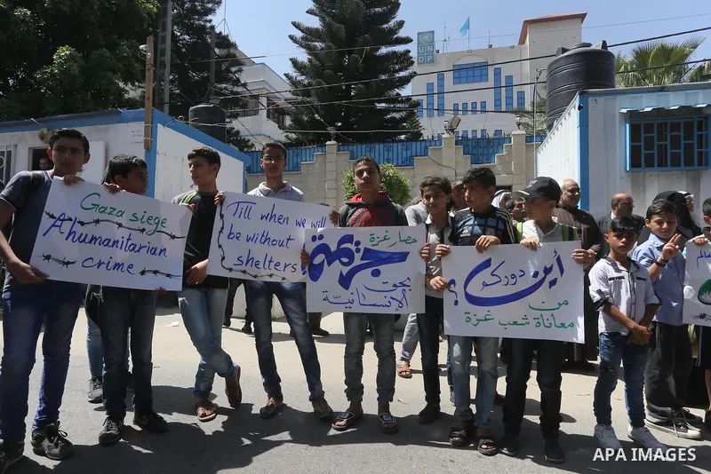 Palestinian owners of houses which were destroyed during the recent Israeli war, take part in a protest, in front of high commissioner for human rights headquarters, in Gaza City on April 20, 2016. Israeli occupation pri...