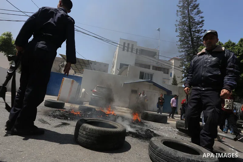 Palestinian owners of houses which were destroyed during the recent Israeli war, take part in a protest, in front of high commissioner for human rights headquarters, in Gaza City on April 20, 2016. Israeli occupation pri...