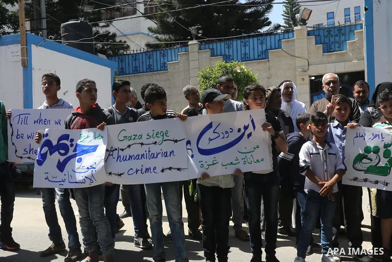 Palestinian owners of houses which were destroyed during the recent Israeli war, take part in a protest, in front of high commissioner for human rights headquarters, in Gaza City on April 20, 2016. Israeli occupation pri...