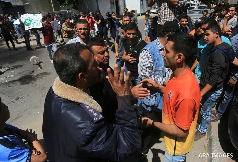 Palestinian owners of houses which were destroyed during the recent Israeli war, burn tires during a protest, in front of high commissioner for human rights headquarters, in Gaza City on April 20, 2016. Israeli occupatio...