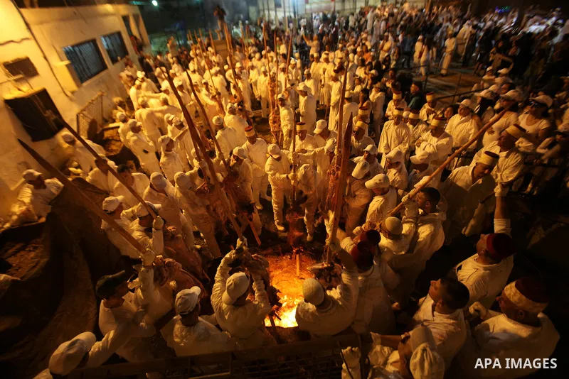 Members of the ancient Samaritan community participate in the ritual of Passover Sacrifice on Mount Grizim, overlooking the West Bank town of Nablus, April 20, 2016. Samaritans descended from the ancient Israelite tribes...