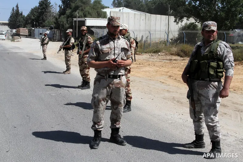 Members of Palestinian security forces loyal to Hamas stand guard as they are deployed to maintain security on the border of southern Gaza Strip with Egypt, April 21, 2016. Hamas began deploying additional forces on the...