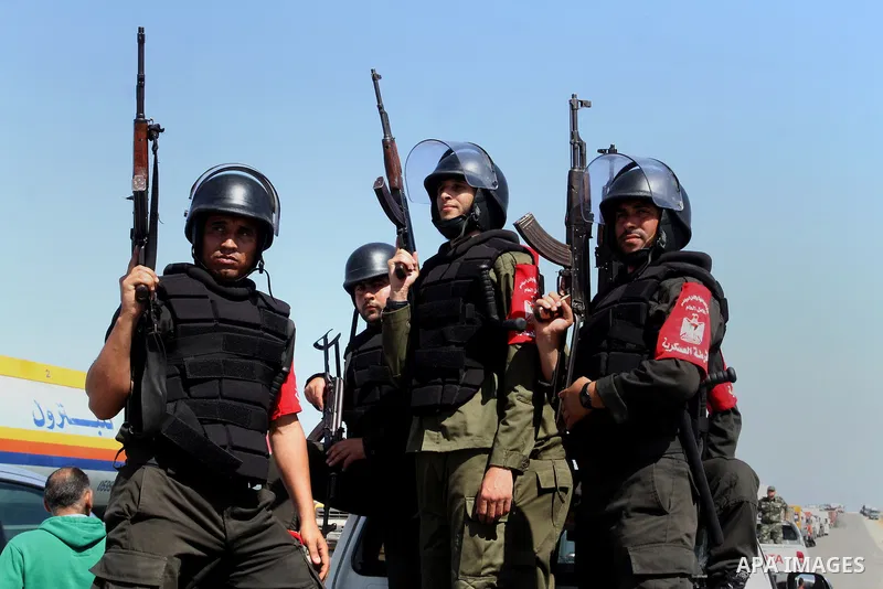 Members of Palestinian security forces loyal to Hamas ride a pickup truck as they are deployed to maintain security on the border of southern Gaza Strip with Egypt, April 21, 2016. Hamas began deploying additional forces...
