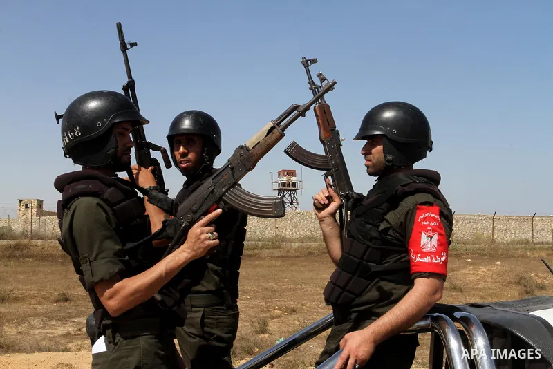 Members of Palestinian security forces loyal to Hamas ride a pickup truck as they are deployed to maintain security on the border of southern Gaza Strip with Egypt, April 21, 2016. Hamas began deploying additional forces...
