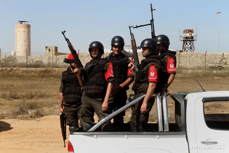 Members of Palestinian security forces loyal to Hamas ride a pickup truck as they are deployed to maintain security on the border of southern Gaza Strip with Egypt, April 21, 2016. Hamas began deploying additional forces...