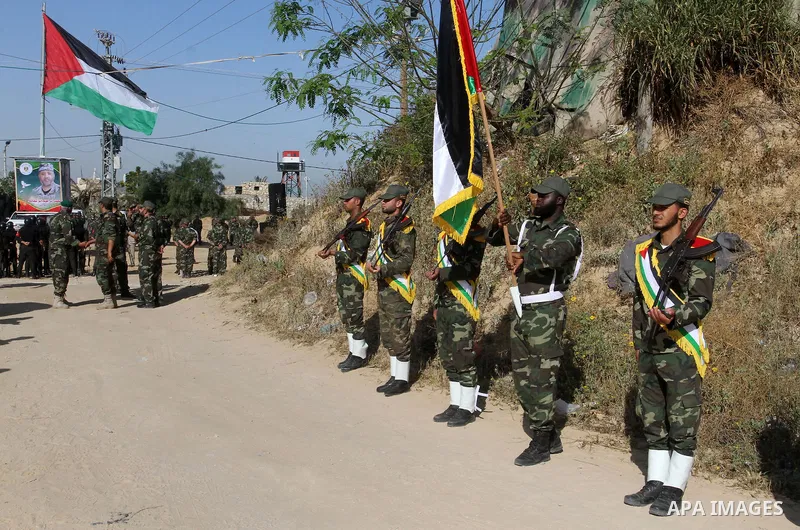 Members of Palestinian security forces loyal to Hamas salute as they are deployed to maintain security on the border of southern Gaza Strip with Egypt, April 21, 2016. Hamas began deploying additional forces on the Gaza...
