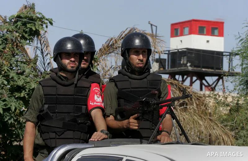 Members of Palestinian security forces loyal to Hamas ride a pickup truck as they are deployed to maintain security on the border of southern Gaza Strip with Egypt, April 21, 2016. Hamas began deploying additional forces...