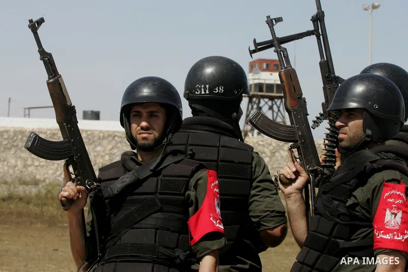 Members of Palestinian security forces loyal to Hamas ride a pickup truck as they are deployed to maintain security on the border of southern Gaza Strip with Egypt, April 21, 2016. Hamas began deploying additional forces...