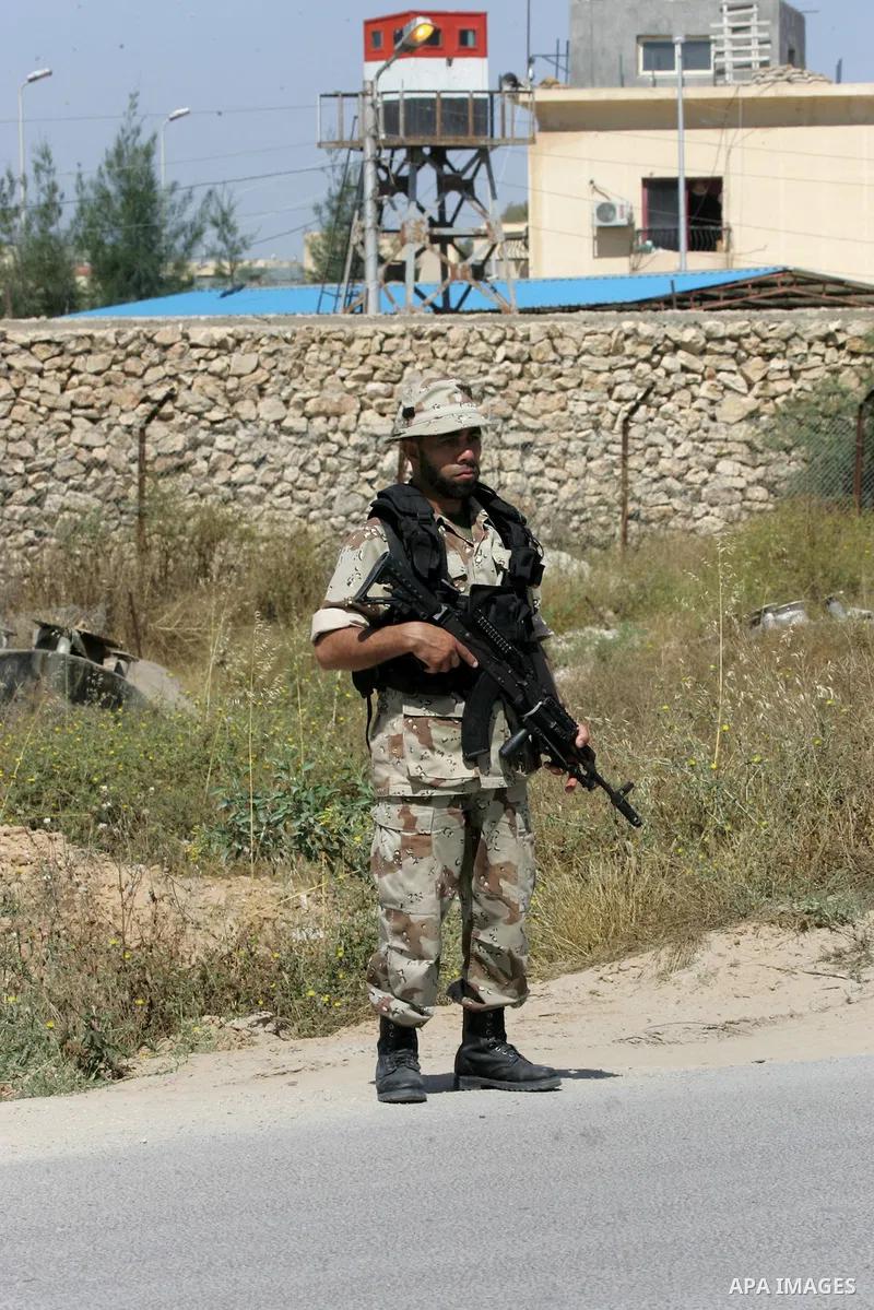 A member of Palestinian security forces loyal to Hamas looks on as he is deployed to maintain security on the border of southern Gaza Strip with Egypt, April 21, 2016. Hamas began deploying additional forces on the Gaza...