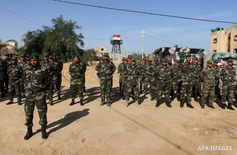 Members of Palestinian security forces loyal to Hamas salute as they are deployed to maintain security on the border of southern Gaza Strip with Egypt, April 21, 2016. Hamas began deploying additional forces on the Gaza...