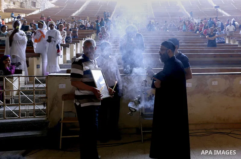 Egyptian Coptic Christian attend the Palm Sunday celebrations at the Deir Samaan Church in Cairo, Egypt, Saturday, April 24, 2016. Photo by Amr Sayed