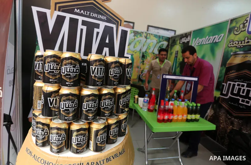 Palestinians attend exhibition for national products at Islamic University, in Gaza city, on April 24, 2016. Photo by Mohammed Asad
